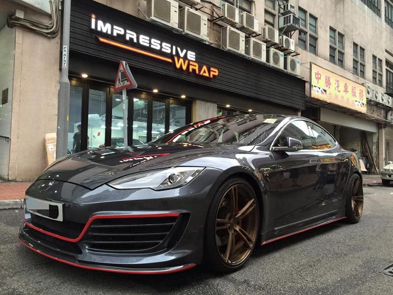 Tesla Model S with red accents by Impressive Wrap