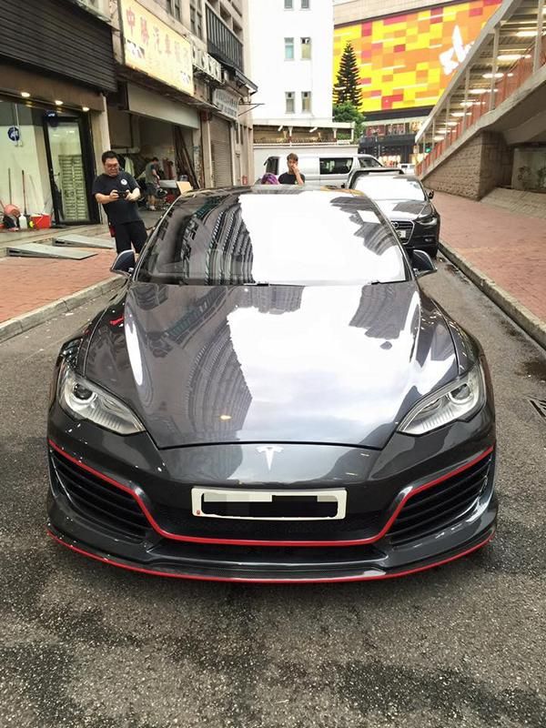 Tesla Model S with red accents by Impressive Wrap