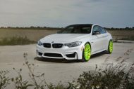 Visible - BMW M4 F82 on bright green road Wheels Alu's