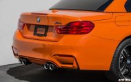 BMW M4 F83 Décapotable de EAS Tuning peinte en orange feu
