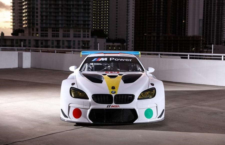 BMW M4 GT3 racing car shows partly new M4 front