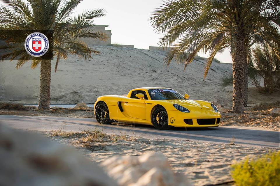 Bright yellow Porsche Carrera GT on black HRE P101 Alu's