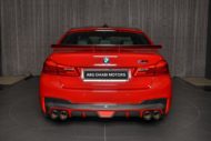 Schnitzer-onderdelen voor de BMW M5 (F90) Competitie in Imola Red