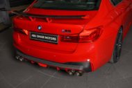 Schnitzer-onderdelen voor de BMW M5 (F90) Competitie in Imola Red