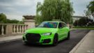 Neon green Audi RS4 with 20-inch aluminum and stance tuning.