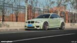 Lime green BMW 1er M Coupé (E82) with 420 PS, race optics & BBS rims.