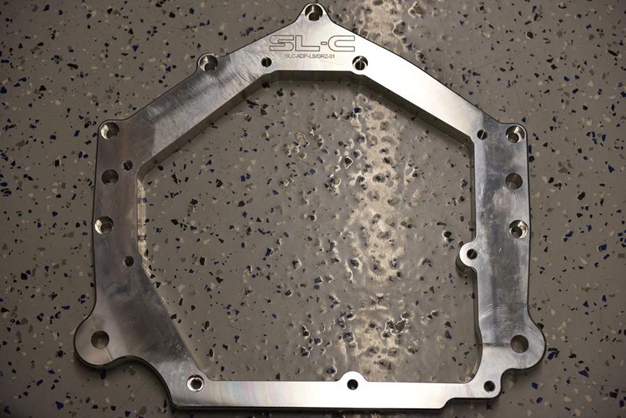 What is a transmission adapter plate?